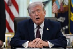 President Donald Trump answers reporters in the Oval Office at the White House in Washington on March 31, 2026
