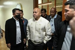 Philippine Senator Ronald dela Rosa speaks to reporters at the Senate in Pasay City during the standoff over the ICC warrant.