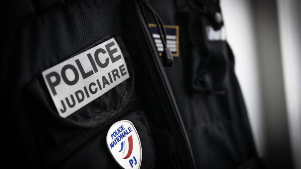 Close-up of French police uniform insignia patches during deployment in Lyon, France, following the fatal beating of a 23-year-old activist near Sciences Po university