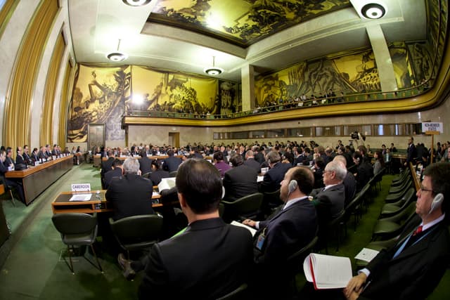 A conference hall at the Palais des Nations in Geneva, Switzerland, where international diplomatic negotiations take place