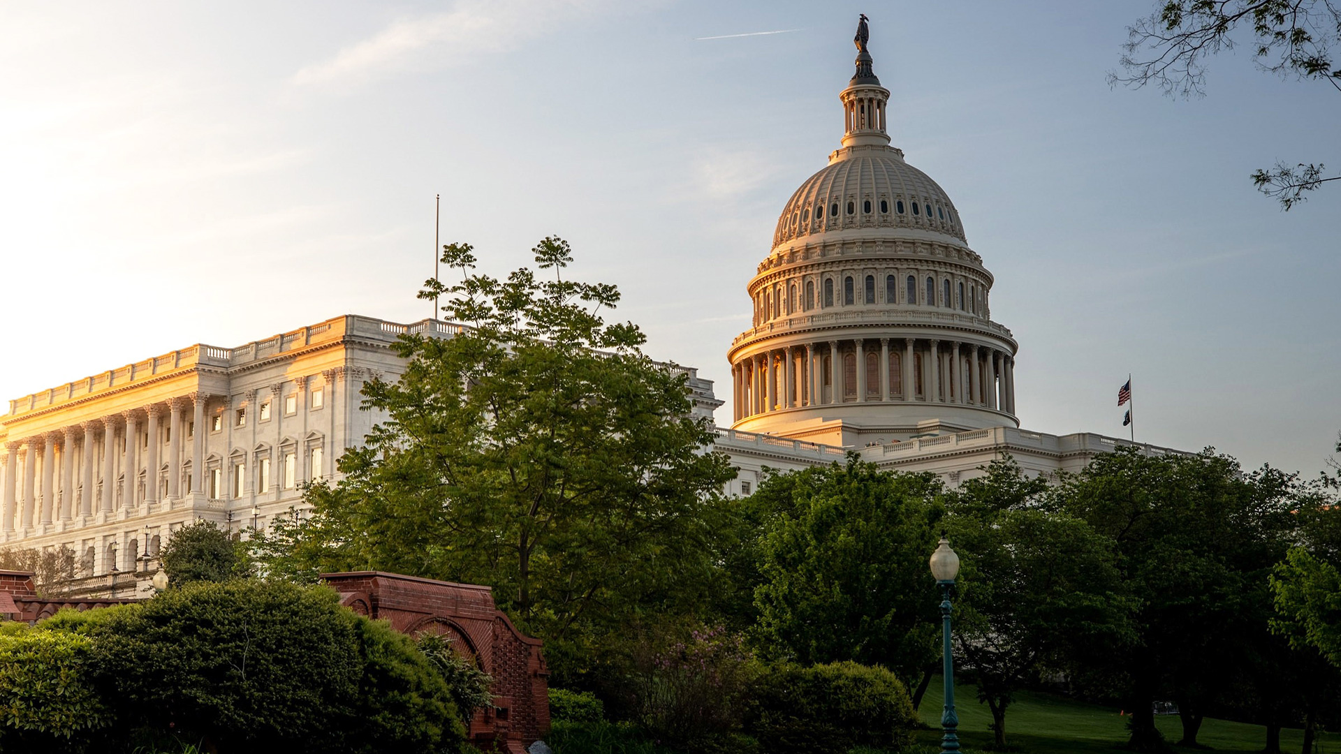 The United States Capitol building in Washington DC at sunrise, viewed from the east side