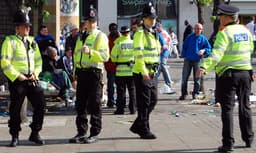 Greater Manchester Police officers on patrol in Piccadilly Gardens, Manchester, England