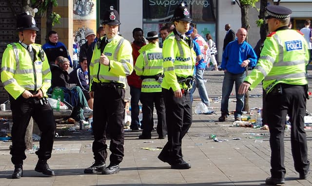 Greater Manchester Police officers on patrol in Piccadilly Gardens, Manchester, England