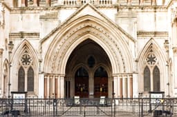 The main entrance of the Royal Courts of Justice in London, a Victorian Gothic stone building with an ornate arched doorway