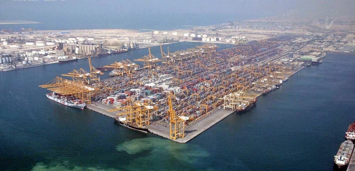 Aerial view of a large container port with cranes and shipping infrastructure in Dubai
