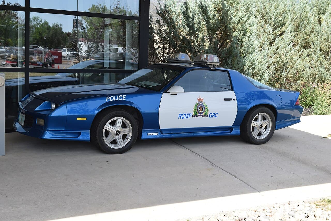 A Royal Canadian Mounted Police (RCMP) patrol vehicle parked at a training facility in Regina, Saskatchewan