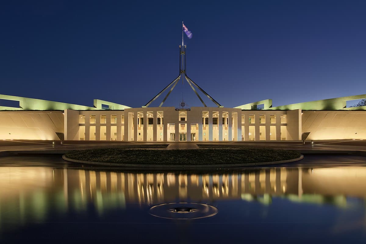 Australian Parliament House in Canberra at dusk, where Angus Taylor was elected Liberal Party leader